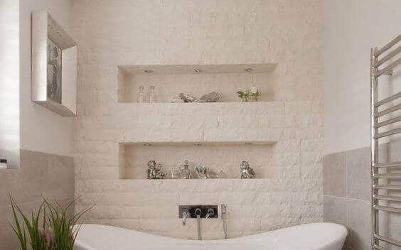 Remodeled bathroom with freestanding bathtub and glass shower