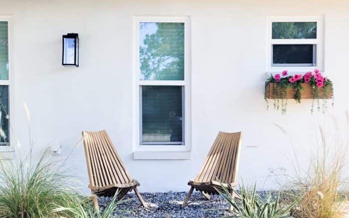 Home exterior with refreshed facade, garden beds and pathway