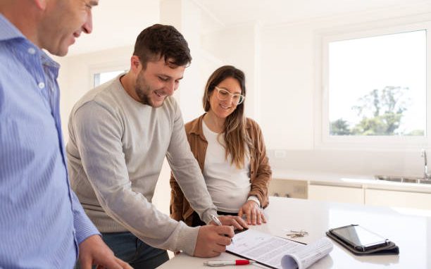 Homeowners reviewing renovation financing and warranty documents